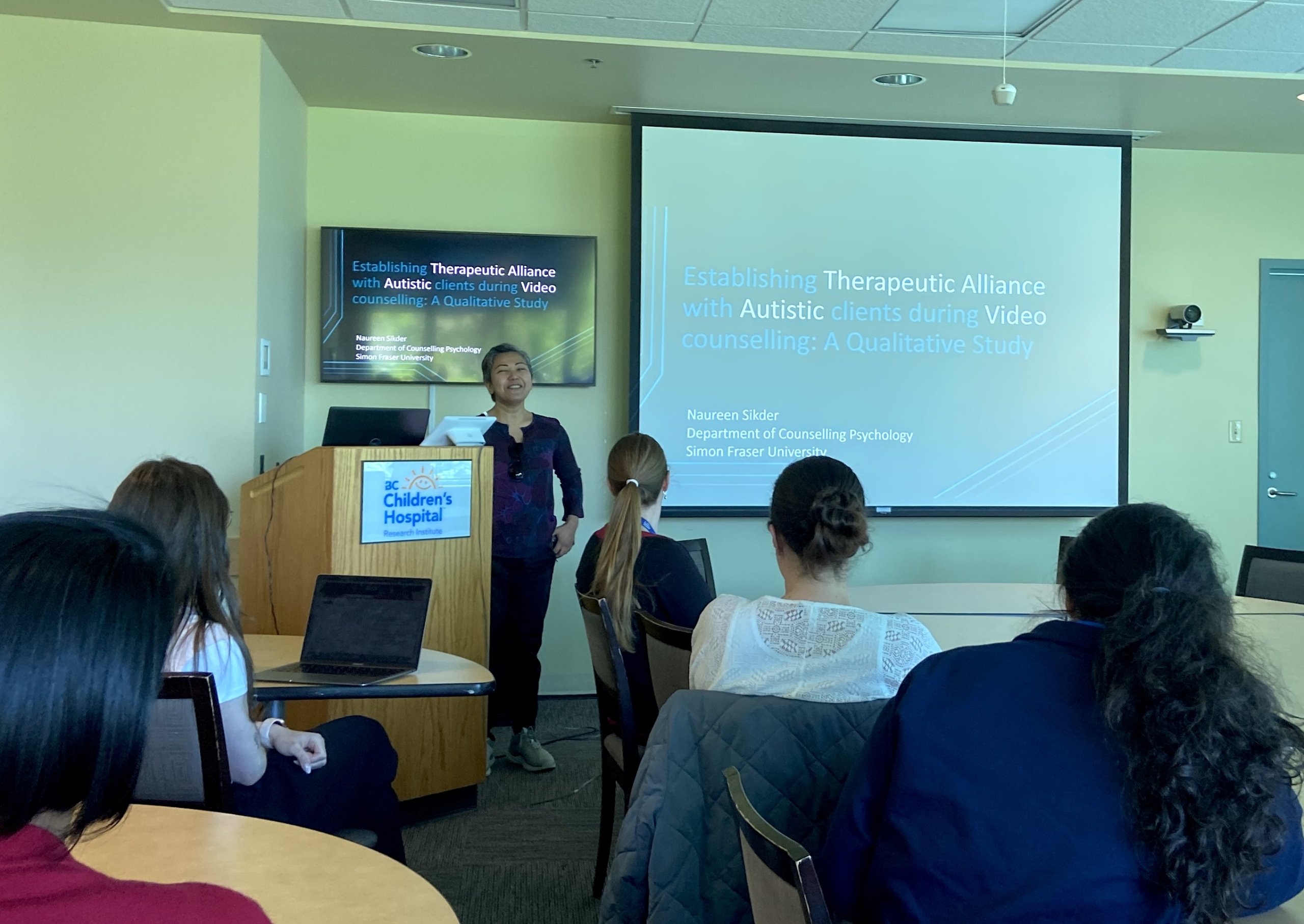 Naureen Sikder presenting a talk at the BCCH Autism Event.